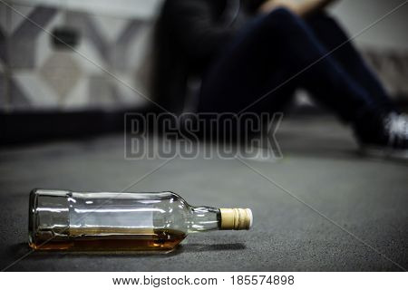 Liquor Alcohol Bottle Lying on The Floor