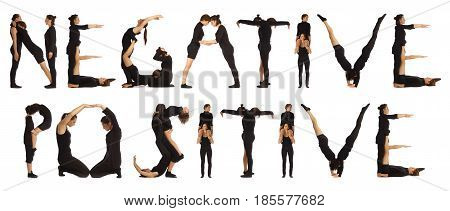 Black dressed people forming word NEGATIVE POSITIVE on white background