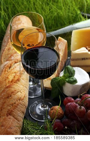 Cheese Platter And Wine With Different Cheese And Grapes