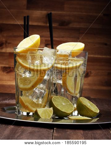 Lemonade With Fresh Lemon On Wooden Background