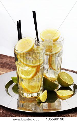 Lemonade With Fresh Lemon On Wooden Background