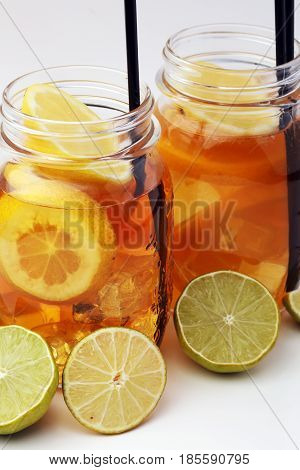 Iced Tea With Lemon Slices And Mint On White Background
