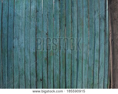 Background from a wooden fence of blue color