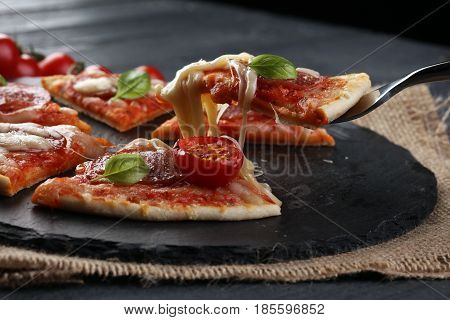 Hot true PEPPERONI ITALIAN PIZZA with salami and cheese. TOP VIEW Tasty traditional pepperoni pizza on board on wooden table with decoration