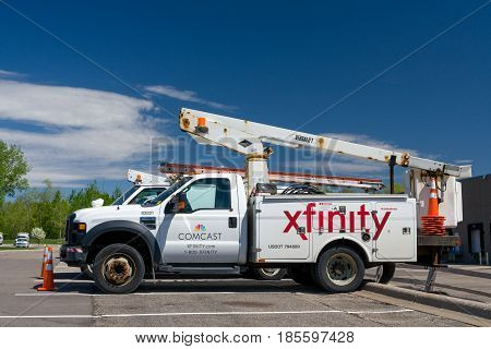 ST. PAUL MN/USA - MAY 7 2017: Comcast Xfinity service vehicle and logo. Xfinity is a brand of Comcast Cable Communications.