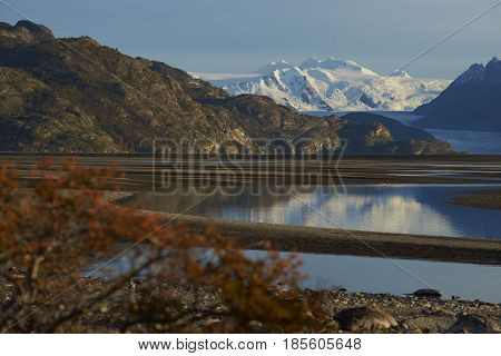 Lago Grey surrounded  mountain peaks in Torres del Paine National Park in Patagonia, Chile. Glacier Grey in the distance.