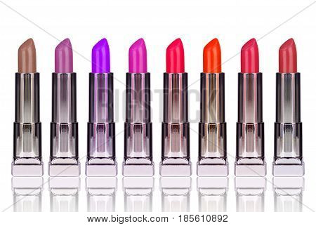 Set of multicolored lipsticks isolated on white background