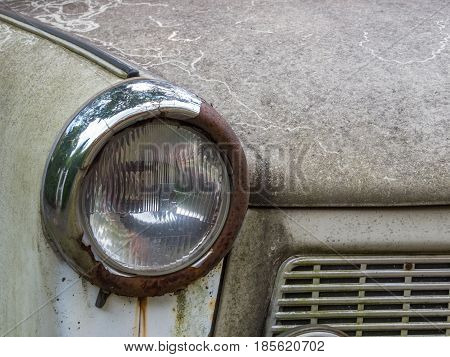 Berlin Germany - August 23 2014: Headlight of a rusted old Trabant well known model in the former German Democratic Republic