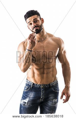 Handsome bodybuilder doing typical Italian hand gesture meaning a general question, with silly expression, looking at camera, isolated on white background