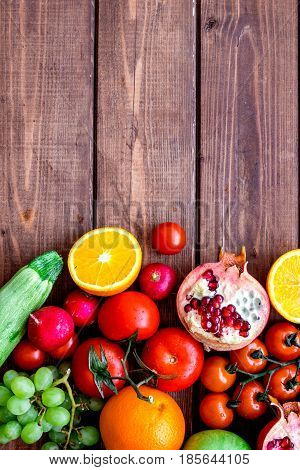 cooking salad with fresh fruits and vegetables on wooden desk background top view mock-up