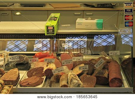 Oulu, Finland - April 11, 2017: Meat and sausages on shopwindow at the european market in Oulu, Finland