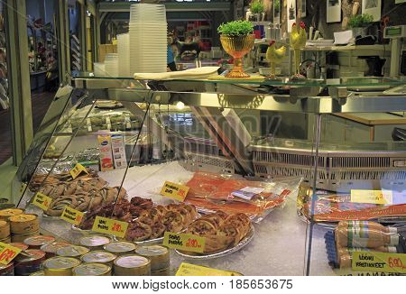 Oulu, Finland - April 11, 2017: stall with small pies and fish at market in Oulu, Finland