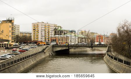 Moscow, Russia - April 12, 2017: Small Krasnokholmsky bridge in the street Zatsepsky Val in cloudy weather in Moscow