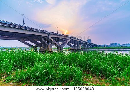 Bridge with sunset in Yanping riverside park in Taipei