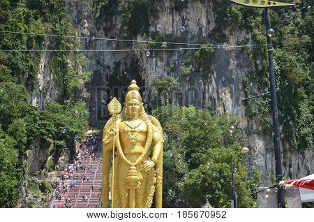 batu caves in malaysia golden statue with soap bubbles