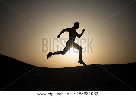 Running Man Silhouette At Sunset Sky