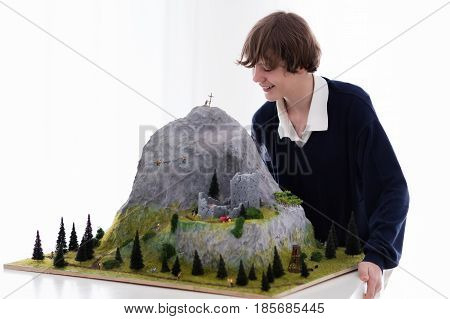 School Student Working On Model Building Project