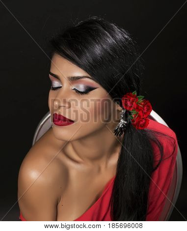 young attractive brunette posing make-up in red shirt