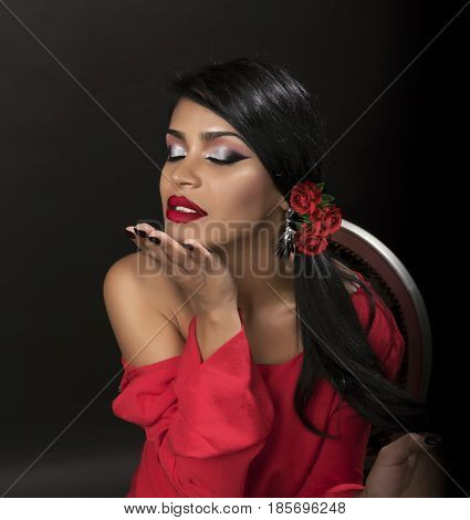 young attractive brunette posing make-up in red shirt