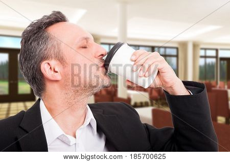 Closeup Portrait Of Real Estate Agent Drinking Espresso