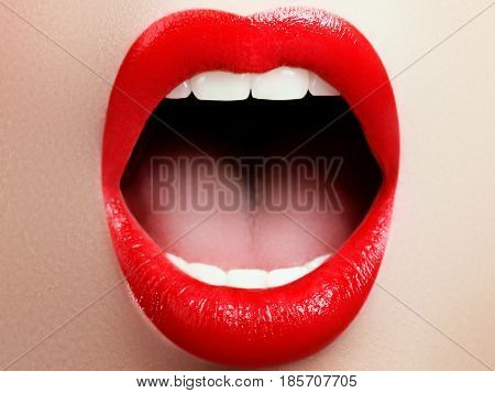 Close-up Of Woman's Lips With Fashion Red Make-up. Beautiful Female Mouth, Full Lips With Perfect Ma