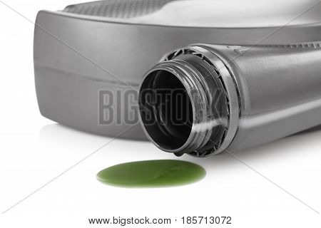 The oil for the engine flows the open plastic canister the green motor grease with molygen
