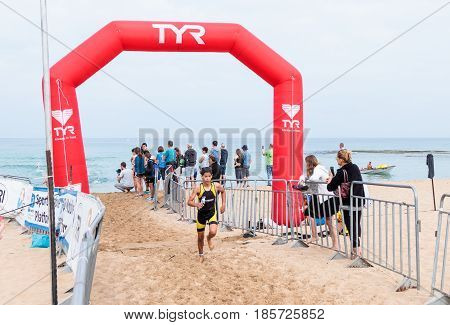 Nahariyya Israel - May 06 2017 : Participants of the annual triathlon finish in the swim in the Mediterranean Sea in Ahziv near the town of Nahariya