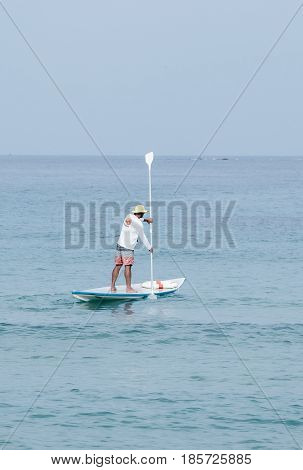Nahariyya Israel - May 06 2017 : Rescuer on the lifeboat watches the participants of the annual triathlon which participate in a swim in the Mediterranean Sea in Ahziv near the town of Nahariya
