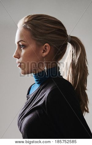 Woman profile with ponytail and natural makeup