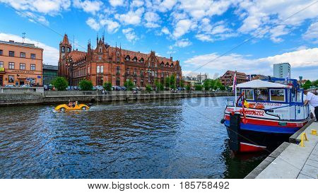 Bydgoszcz, Poland - May 8, 2016; Old Town And Tourist Boat - Cruise Ship On Brda River