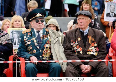 Orel Russia - May 9 2017: Celebration of 72th anniversary of the Victory Day (WWII). Senior Soviet veterans in uniform with medals closeup