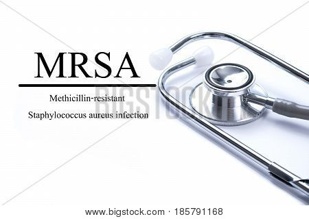 Page with MRSA (Methicillin-resistant Staphylococcus aureus infection) on the table with stethoscope medical concept