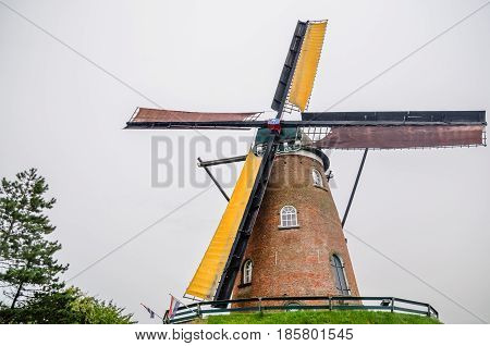 View on wooden windmill by Bruges in Belgium