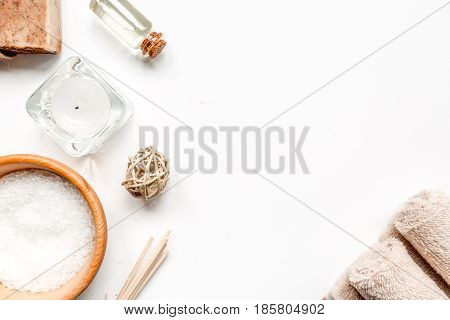 spa composition for body care with sea salt on white background top view mock up