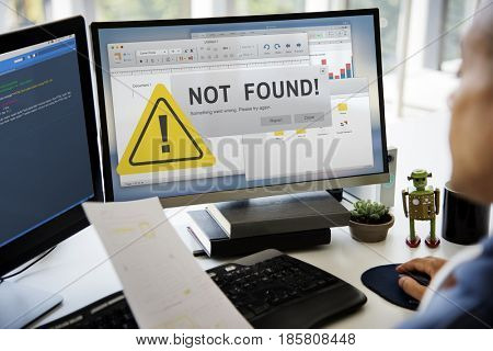 Woman working on computer network graphic overlay