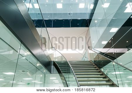 Staircase looking upwards in office building interior