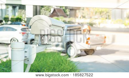 Security equipment concept - CCTV camera surveillance on car parking Safety system area control with flare light and copy space