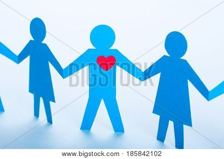 Search for true love or your second half. A dating site a blind date. Like-minded. Paper men holding hands.