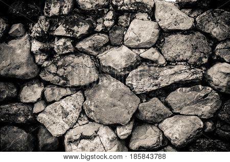 The stones are stacked together as walls.