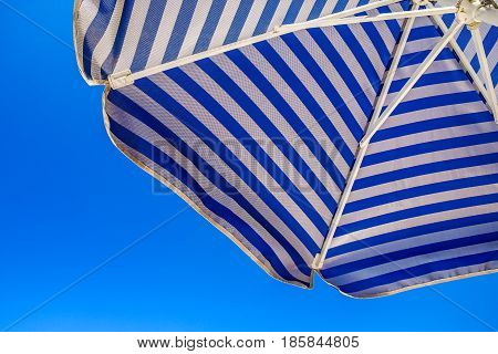 beach umbrella with blue and white stripes