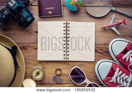 Planning for trip clothing and accessories on wood floo