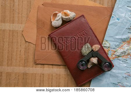 Travel Planning - Map With Passport, Shells And Binoculars