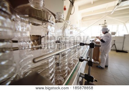 Bottle. Industrial production of PET bottles. Transparent packaging for food products