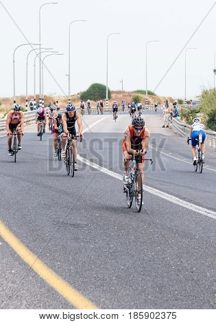 Nahariyya Israel - May 06 2017 : Participants of the annual triathlon competes in cycling on the route in Ahziv near Nahariyya Israel