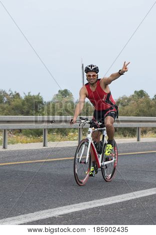 Nahariyya Israel - May 06 2017 : Participants of the annual triathlon competes in cycling on the route in Ahziv near Nahariyya Israel