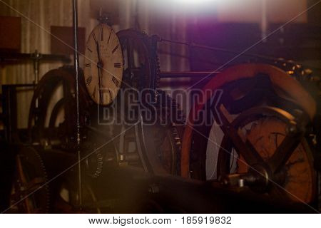 Retro driving mechanism of the city clock in the city hall. Old photo effect applied. Toned.