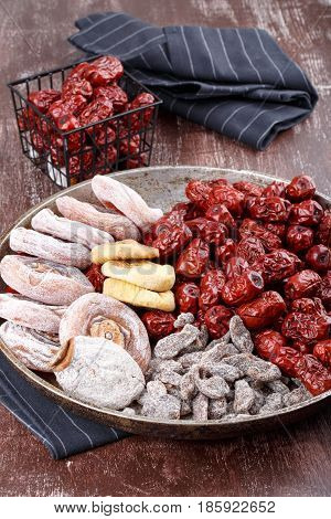 Dried fruits - persimmon figs red dates or jujube and salted sliced plum.