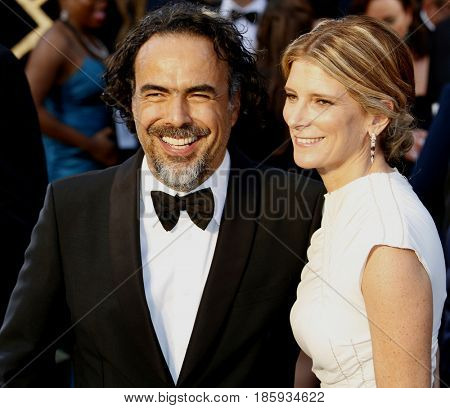 Alejandro Gonzalez Inarritu and Maria Eladia Hagerman at the 88th Annual Academy Awards held at the Hollywood & Highland Center in Hollywood, USA on February 28, 2016.