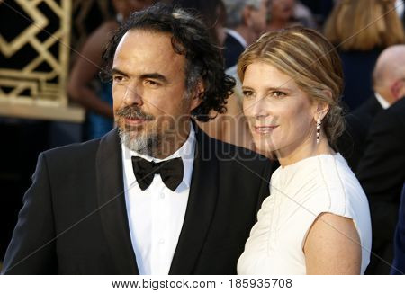 Alejandro Gonzalez Inarritu and Maria Eladia Hagerman at the 88th Annual Academy Awards held at the Hollywood & Highland Center in Hollywood, USA on February 28, 2016.