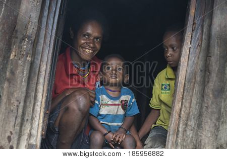 Wamena West Papaua Jayapura - February 13th 2016: Dani tribe boy in his home